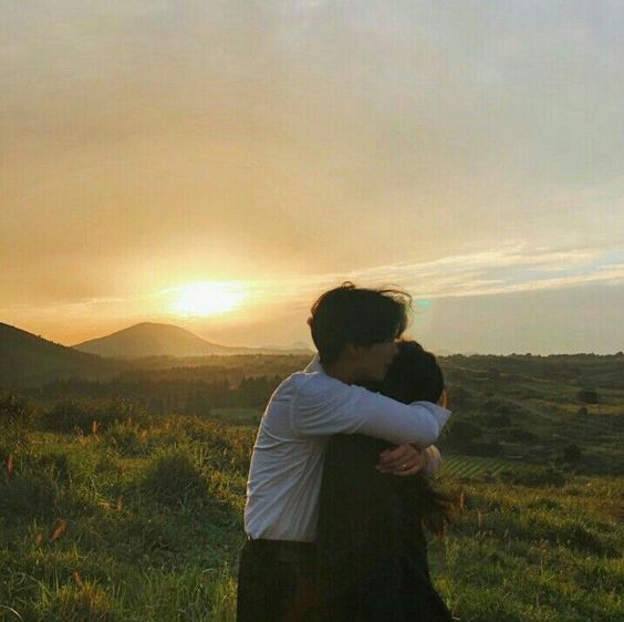 couple hugging during sunset